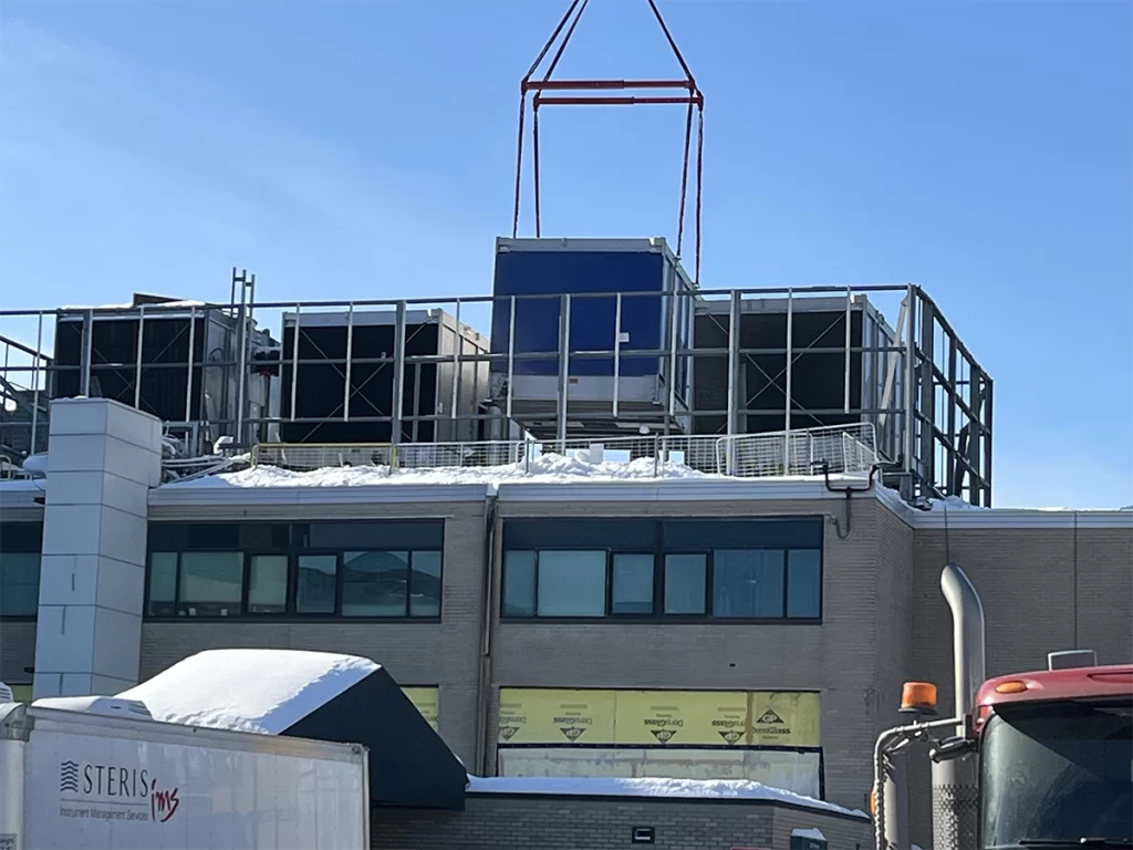 Rooftop mechanical unit installation at Southern New Hampshire Medical Center using crane lift