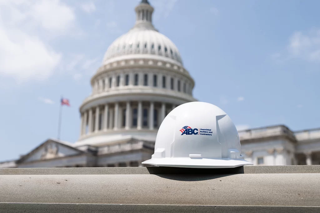 Associated Builders and Contractors hard hat in front of the U.S. Capitol during construction industry advocacy meetings