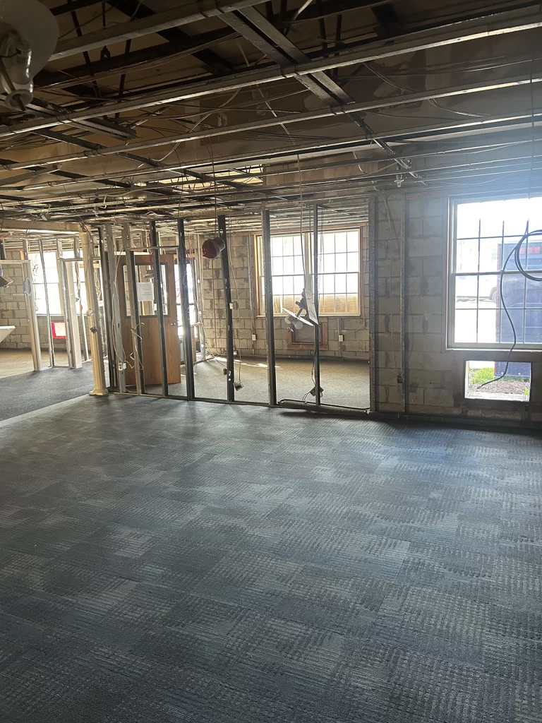 Hampstead Hospital lobby interior during renovation with partitions and ceiling finishes removed