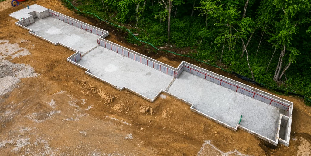 Aerial view of the completed foundation for the new six-unit residential building at the Pelham Terrace housing development in Pelham, NH.