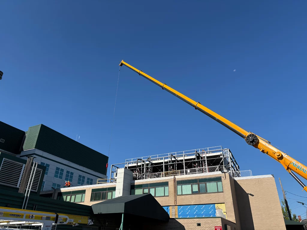 Crane performing roof demolition at Southern New Hampshire Medical Center during the North 1 renovation in Nashua, NH