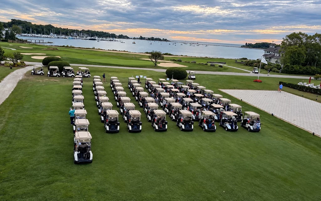 Aerial view of golf carts lined up at Wentworth By The Sea Country Club for Fulcrum Associates' 10th Annual Charity Golf Classic in Rye, NH.